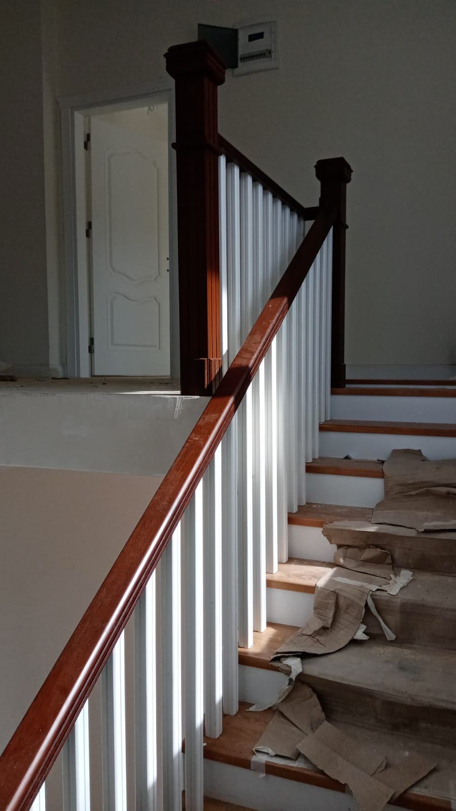 Staircase with White and Wooden Details