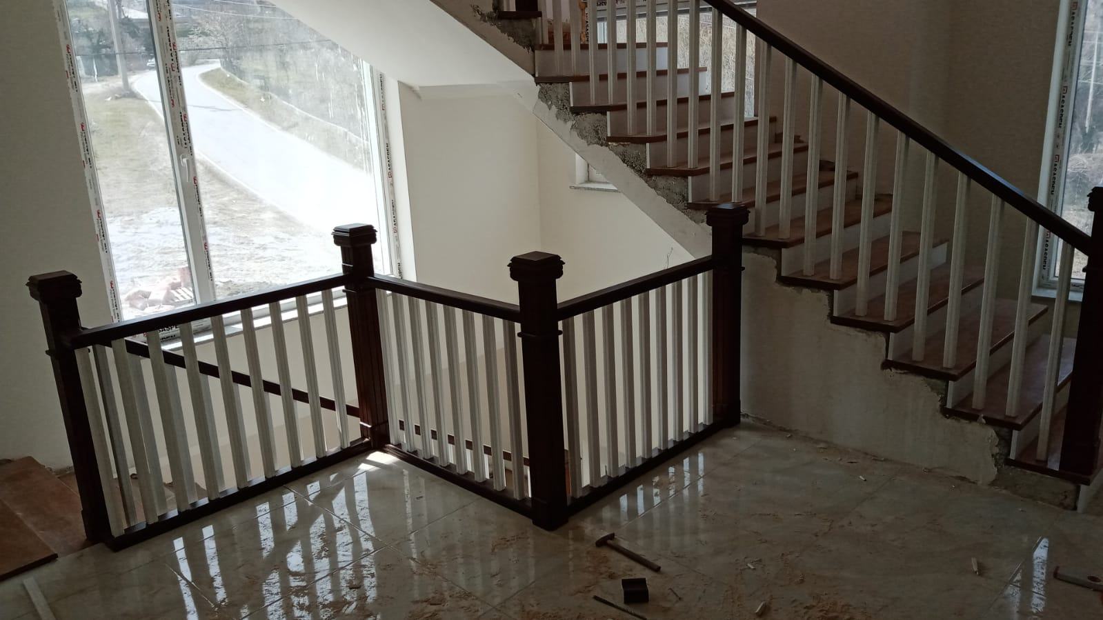 Staircase with White and Wooden Details