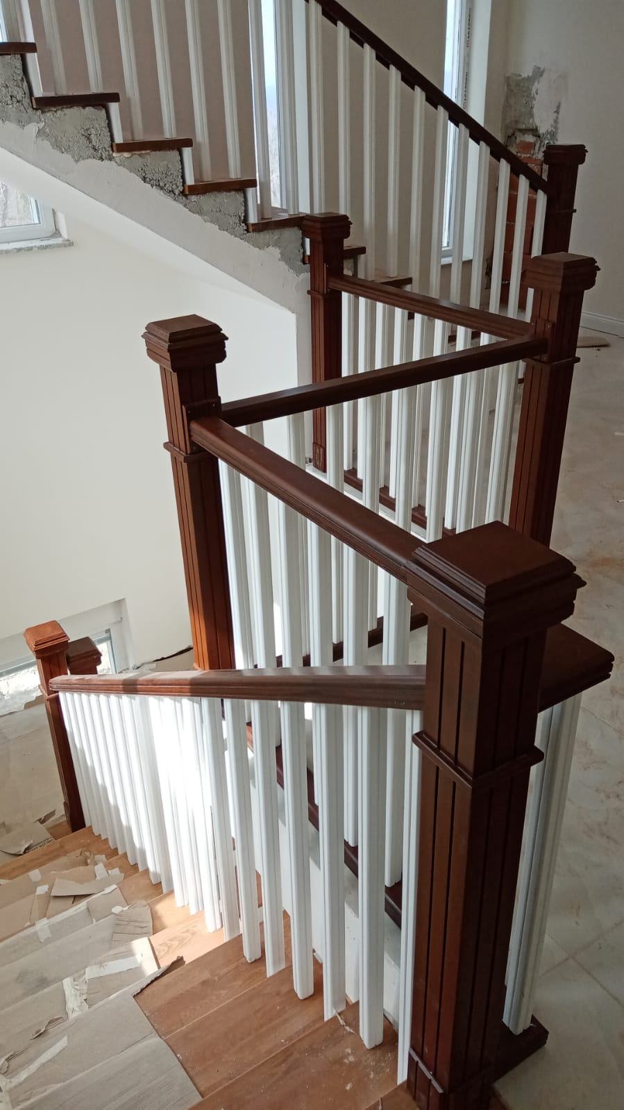 Staircase with White and Wooden Details
