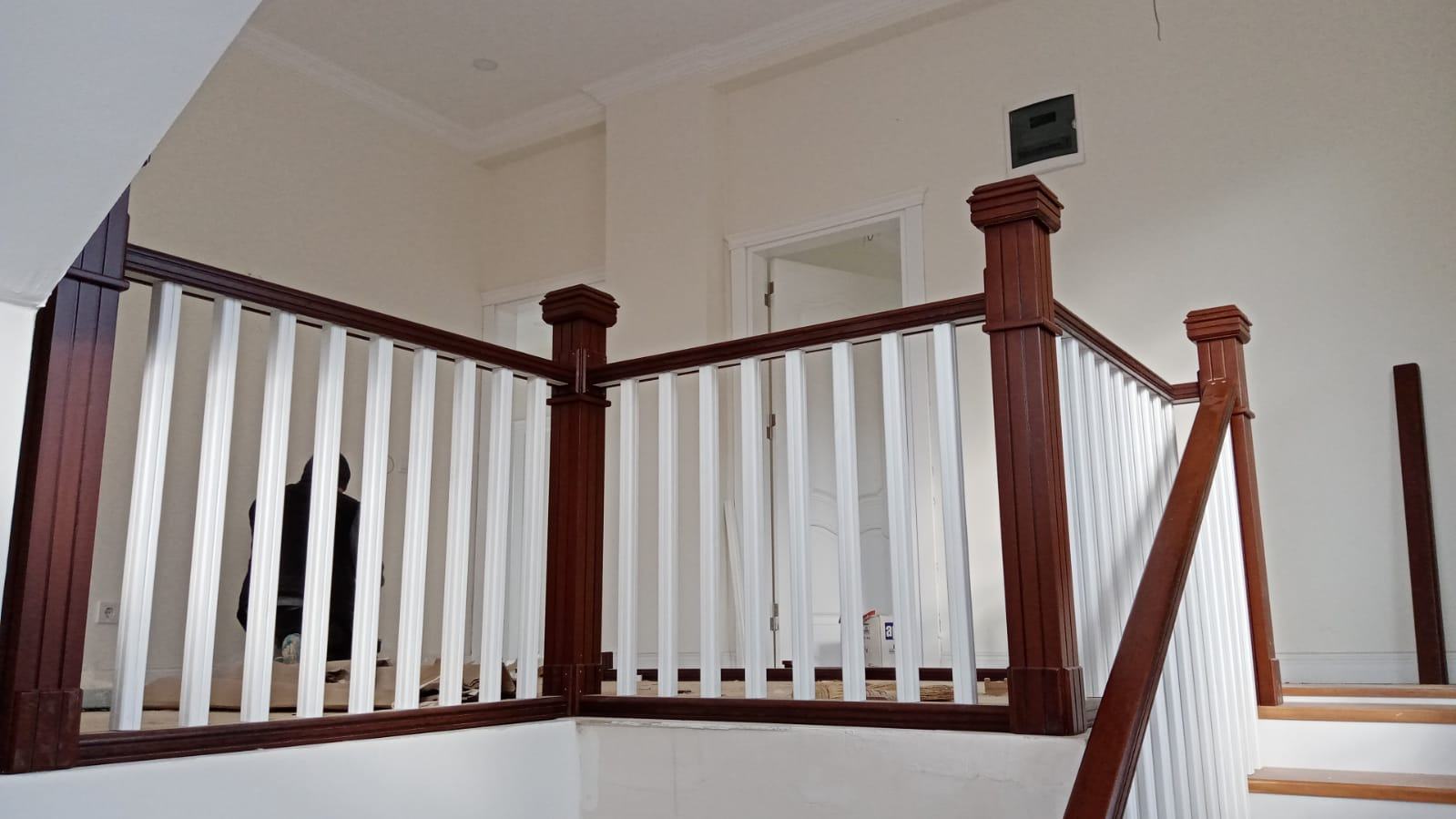 Staircase with White and Wooden Details